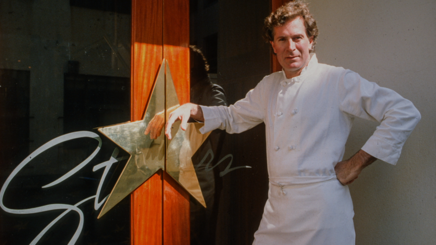 The irascible chef poses in front of his San Francisco restaurant in the documentary <em>Jeremiah Tower: The Last Magnificent.</em>