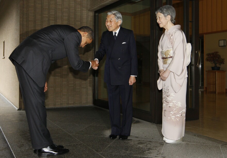 President Obama bows as he greets Japanese Emperor Akihito and Empress Michiko at the Imperial Palace in Tokyo in 2009. The president travels to Japan next month and there's speculation he might visit Hiroshima, the site of the world's first atomic bombing.