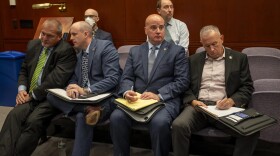 Master Sgt. Todd Fedigan (second from left), president of the State Police Union, and Andrew Matthews, general counsel and executive director of the union (third from left), prepare to address the state Judiciary and Public Safety committees during a forum on state police traffic stop data on July 26, 2023. The report, released by the Connecticut Racial Profiling Prohibition Project, showed thousands of traffic tickets were falsified between 2014 and 2021, skewing race and ethnicity data.