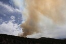  Smoke drifts above a wildfire in Utah last summer.