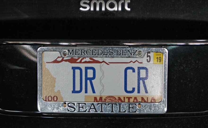 Bartlett's license plate reflects her dedications to accounting. DR and CR are Latin abbreviations for "debit" and "credit" respectively.