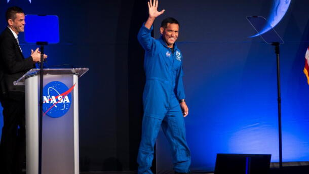 Artemis III crew member Frank Rubio waves to the crowd during a press conference at Johnson Space Center on Tuesday, June 9, 2026, in Houston. (Annie Mulligan/AP)