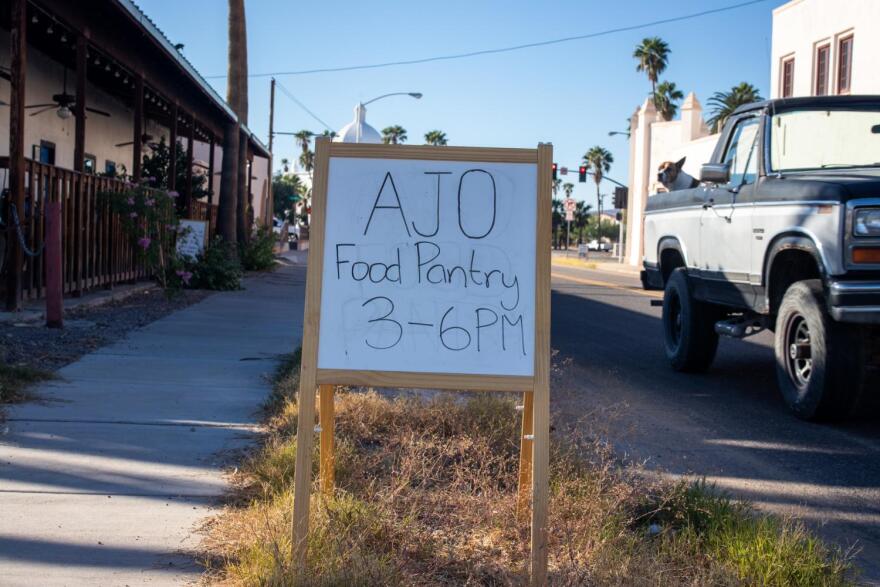 A sign stands in front of the Ajo Farmers Market & Cafe
