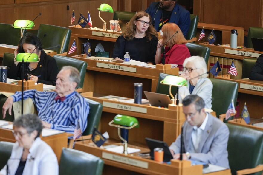 Oregon state Representative and House Democratic Majority Leader Julie Fahey, top left, talks with state Rep. Susan McLain on the House floor at the state Capitol on Friday, June 27, 2025, in Salem, Ore.
