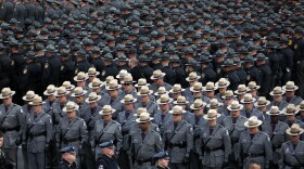 File Image - Pennsylvania state troopers and police officers from around the country line up outside the Blair County Convention Center in Altoona, Pa., following a memorial service Thursday, Jan. 5, 2017, for Pennsylvania State Trooper Landon E. Weaver.