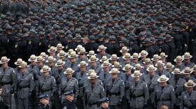 File Image - Pennsylvania state troopers and police officers from around the country line up outside the Blair County Convention Center in Altoona, Pa., following a memorial service Thursday, Jan. 5, 2017, for Pennsylvania State Trooper Landon E. Weaver.