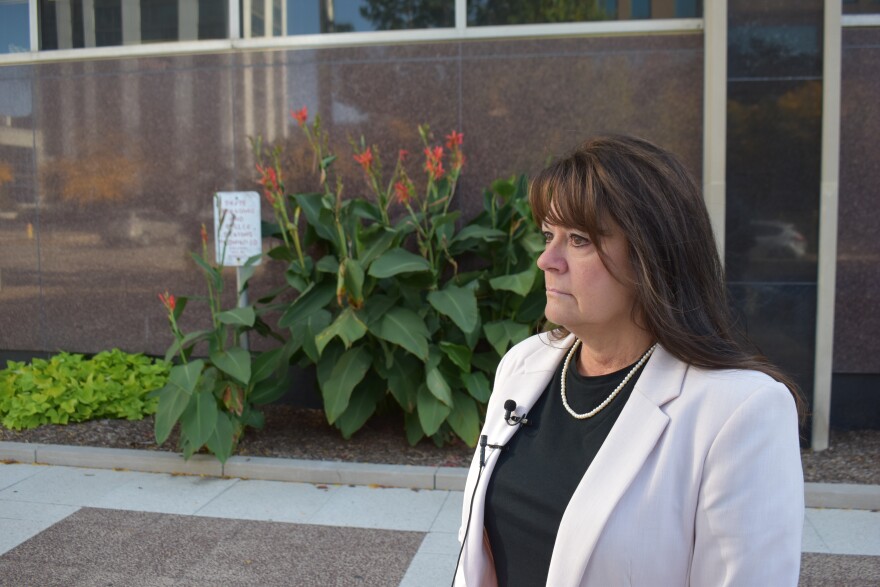 Tazewell County Treasurer Mary Burress speaks in front of the Peoria County Courthouse on Oct. 13, 2020.