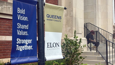 Banners announcing the merger between Queens University and Elon University were seen on the Queens campus on Sept. 23, 2026.