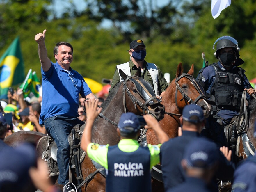 Brazilian President Jair Bolsonaro horse-riding during a demonstration in favor of his government amid the coronavirus pandemic in front of Planalto Palace on May 31, in Brasilia.