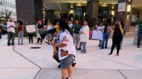 About 150 people protested the presence of Immigration and Customs Enforcement agents at area hotels at a rally Wednesday near the Luminary Hotel in downtown Fort Myers.