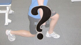 The bottom portion of an image of a person lunging with weights in hand; a question mark in the foreground