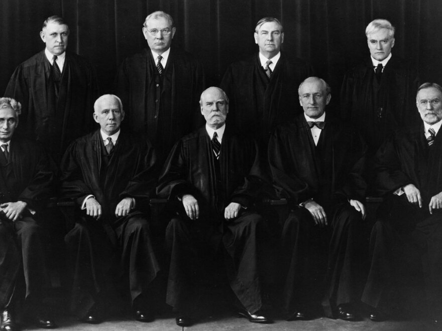 Roosevelt clashed with members of the Supreme Court, including Chief Justice Charles Evans Hughes (center, front row), over his New Deal policies.