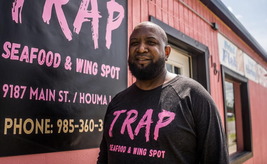 Chad Smith outside of Trap Seafood & Wing Spot in eastside Houma. The restaurant took eight months to reopen after Hurricane Ida made landfall.