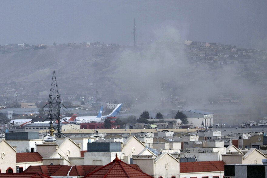 <strong>Thurs., Aug. 26: </strong>Smoke rises from a deadly explosion outside the airport in Kabul.