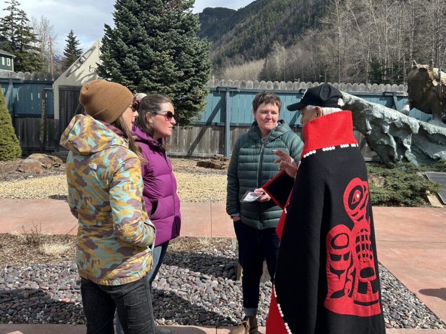 Andrew Beierly, vice-president for Skagway Traditional Council, speaks with guests at the opening of the Skagway Cultural Garden on May 2.