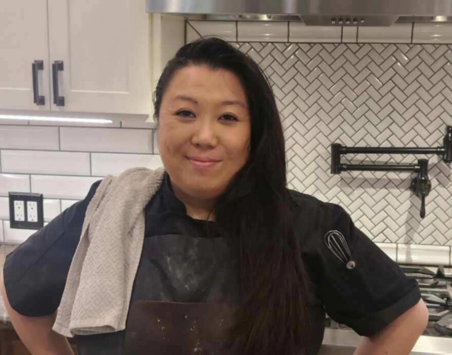 Dana Nguyen stands in her kitchen.