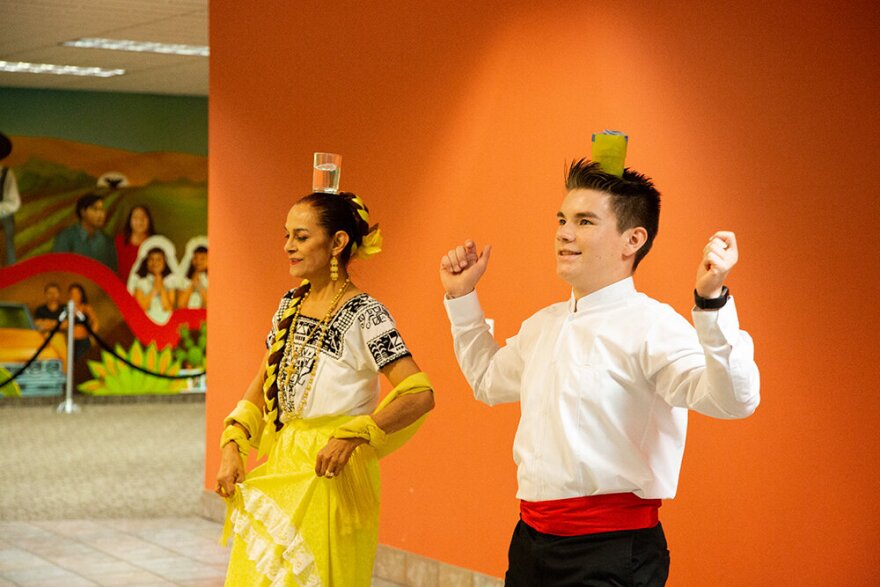 Pintar and Ebert perform Baile de los Almudes. This dance is performed on a wooden box that is historically used to measure and weigh fruits and vegetables in the markets of the Yucatan peninsula.