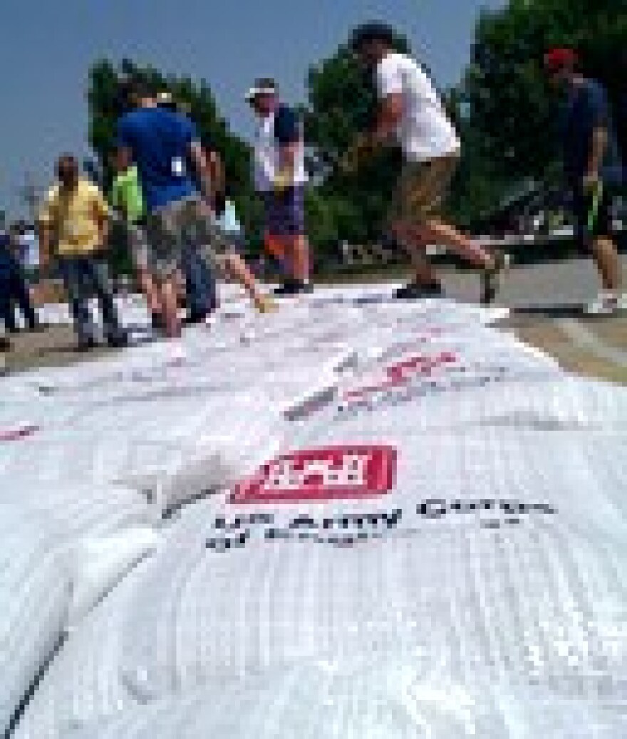 Main Street, Parkville, MO. bears a sandbag stack to ward off expected rise in the nearby Missouri River. (click to enlarge).