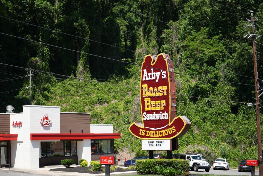 Kudzu covers a patch of woods behind an Arby’s in Knoxville, Tennessee on May 8th 2026.