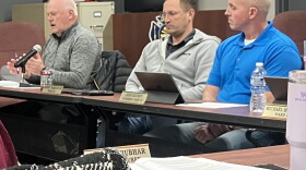 Washington City Council member Brian Butler makes a point during Monday's meeting while fellow council members Bobby Martin III (middle) and John Blundy listen.