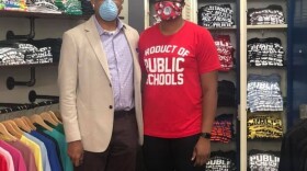 Khisha Asubuhi, owner of Originalitees with a flagship store in Walnut Hills, with AACC CEO Eric Kearney.