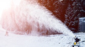 A snow cannon creating artificial snow. 