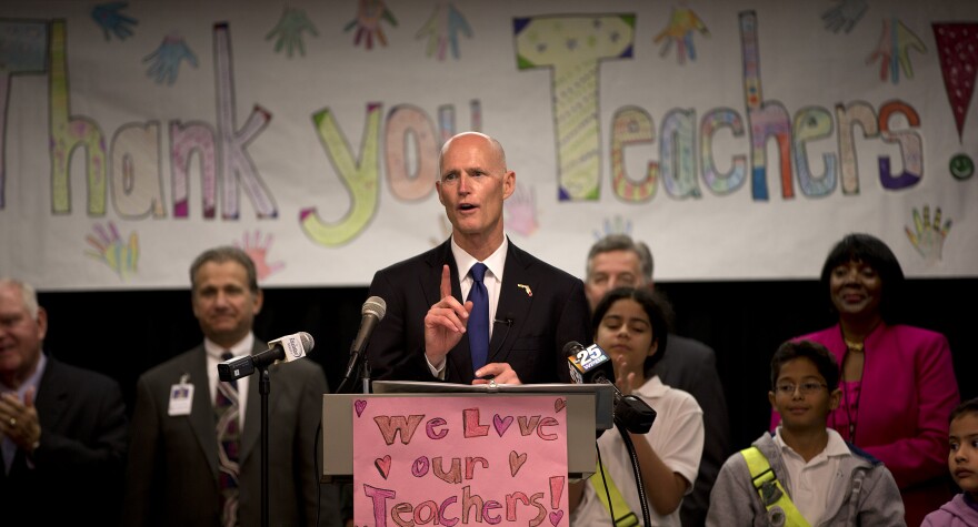 Former Florida Gov. Rick Scott speaks to the students and teachers at the Wynnebrook Elementary school in West Palm Beach, Fla., Monday, May 6, 2013. Then-Gov. Scott signed the Best and Brightest Teacher Scholarship Program into law in 2015.