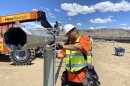  A construction worker works on a pipe.