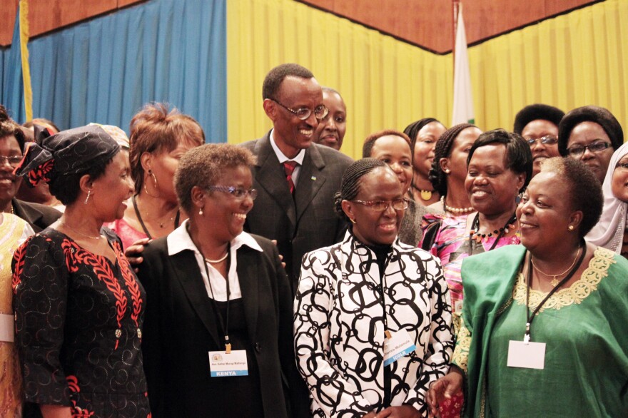 Rwandan President Paul Kagame (center) has been a proponent of putting women in positions of power. He's shown participating in a 2010 conference at the nation's Parliament to discuss the role of women.