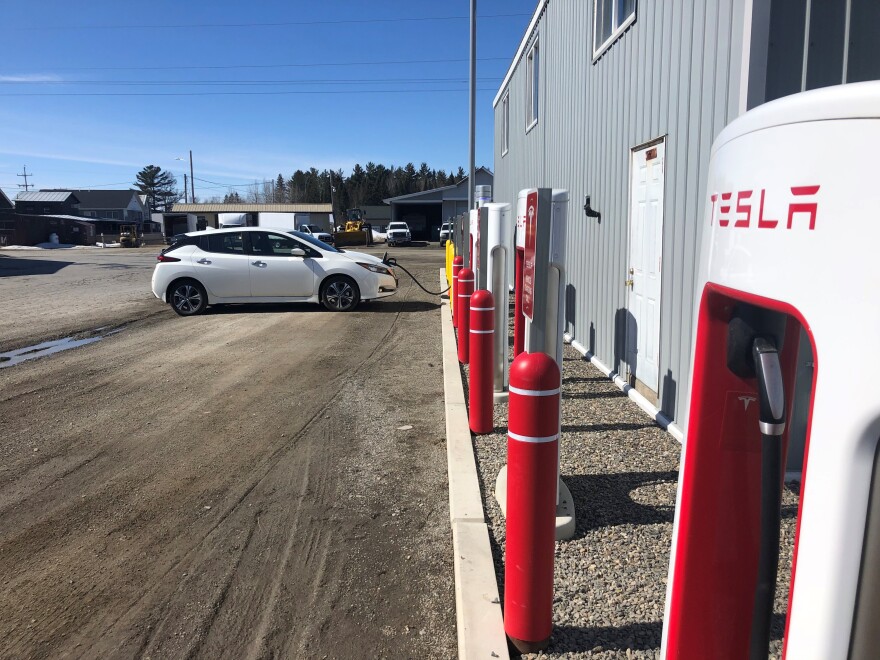 "Gassing up" Maine Public's electric vehicle, Pearl, in Jackman.