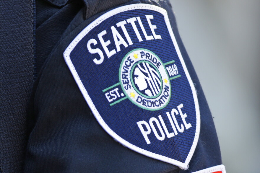 A Seattle Police Department patch is seen on an officer's uniform, July 17, 2016, in Seattle.