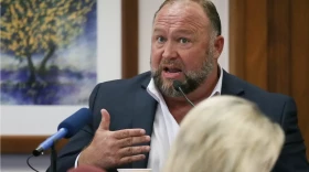 Alex Jones testifies at the Travis County Courthouse during his defamation trial in Austin in 2022