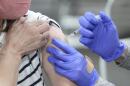 A woman receives a COVID-19 vaccination in Sandy, Utah. (Rick Bowmer/AP)