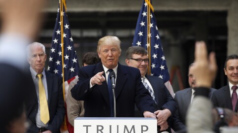 President-elect Donald Trump points to a reporter at Trump International Hotel in Washington.