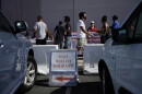 A sign indicates where mail ballots may be dropped off as people wait in line at one of a few in-person voting places during a nearly all-mail primary election in Las Vegas in a 2020 file photo.