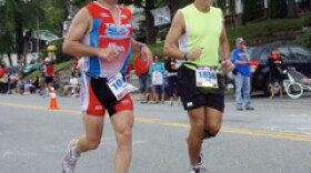 (left) John Rymes running in Lake Placid Ironman Triathlon