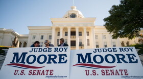 Campaign staff members set up signs before the start of a 'Women For Moore" rally in support of Republican candidate for U.S. Senate Roy Moore, in front of the Alabama State Capitol, Nov. 17, 2017 in Montgomery, Ala.
(Drew Angerer/Getty Images)