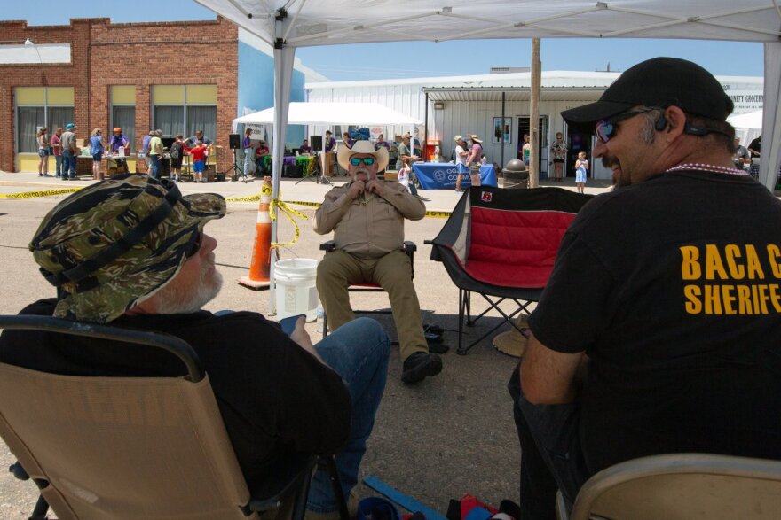 From left, Baca County Sheriff Aaron Shiplett, posse member Steve Sanchez and Deputy Lars Brahn observe Walsh Days festivities.