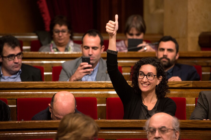 Junts Pel Si (Together for Yes) member of the Catalan Parliament Marta Rovira gives a thumbs up as she votes to pass the start of the independence process Monday in Barcelona, Spain.