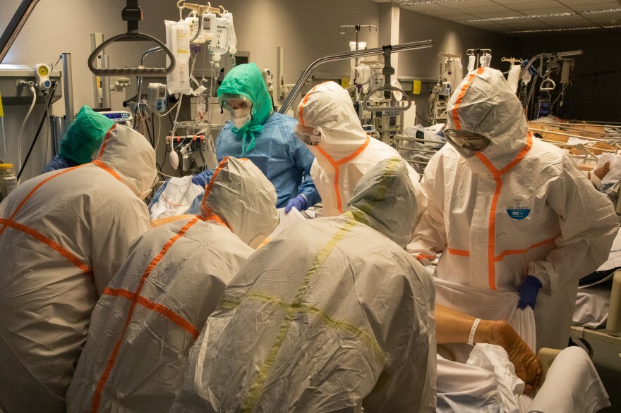 Healthcare workers in the ICU of German Trias i Pujol Hospital in Badalona. Many patients develop a type of pneumonia that requires them to be turned onto their stomachs so they can breathe better. Many healthcare workers are needed to do this safely.