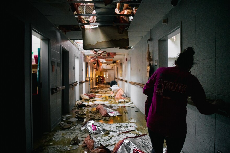 <strong>Sun., Dec. 12:</strong> Nursing home assistant Loretta Duggin walks down a hallway in the Monette Manor nursing home on December in Monette, Arkansas.