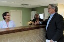 Mike Morrison talks with two staff members at Bridgeway's detox center in St. Louis.