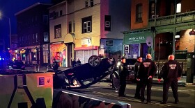 State Rep. Robin Comey's overturned car after a crash near the state Capitol in Hartford. The representative was arrested on charges of drunk driving at the scene.