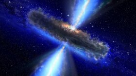 This artist's impression shows the dust torus around a super-massive black hole. Black holes lurk at the centers of active galaxies. The jets emanating from the black hole send neutrinos hurtling into space.