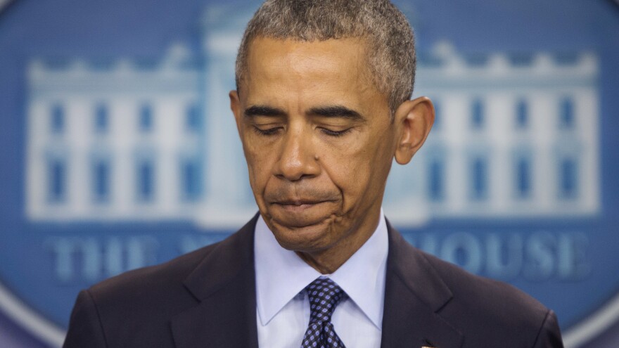 President Obama pauses as he speaks about the massacre at a Orlando nightclub during a news conference at the White House Sunday.