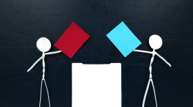 Stick man figures holding red and blue paper ballots on opposite sides of a ballot box