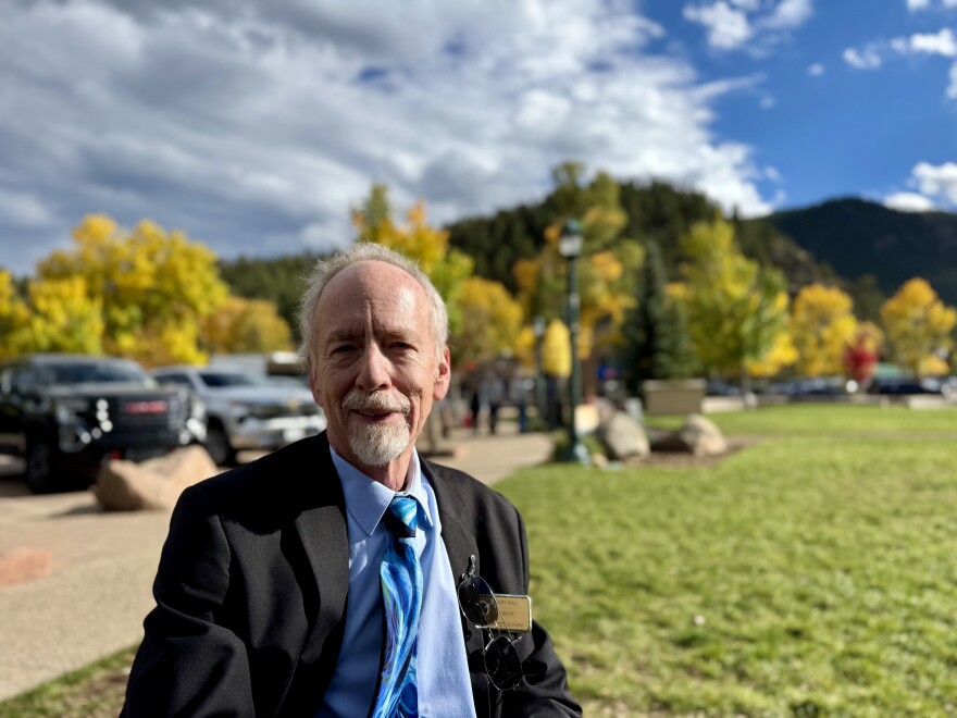 A portrait of Estes Park Mayor Gary Hall in front of yellow aspen trees.
