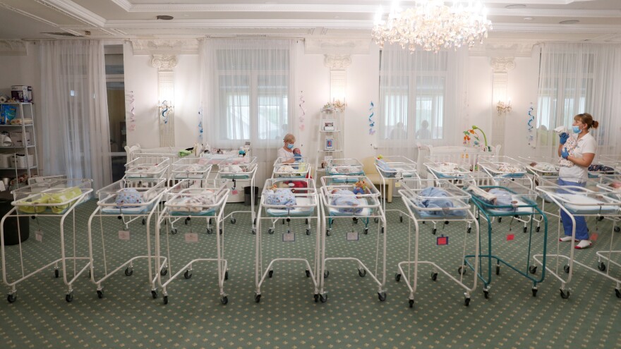 Nurses and newborns in Hotel Venice, a facility owned by BioTexCom clinic in Kyiv, Ukraine, on Thursday. Dozens of babies born to surrogate mothers are stranded in Ukraine as the coronavirus restrictions prevent  foreign parents from collecting them.