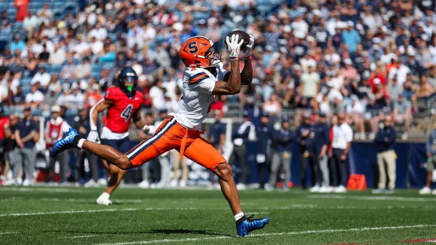 Syracuse wideout Umari Hatcher (2, White) hauls in a pass from Amari Odom during SU’s win over UConn Saturday.