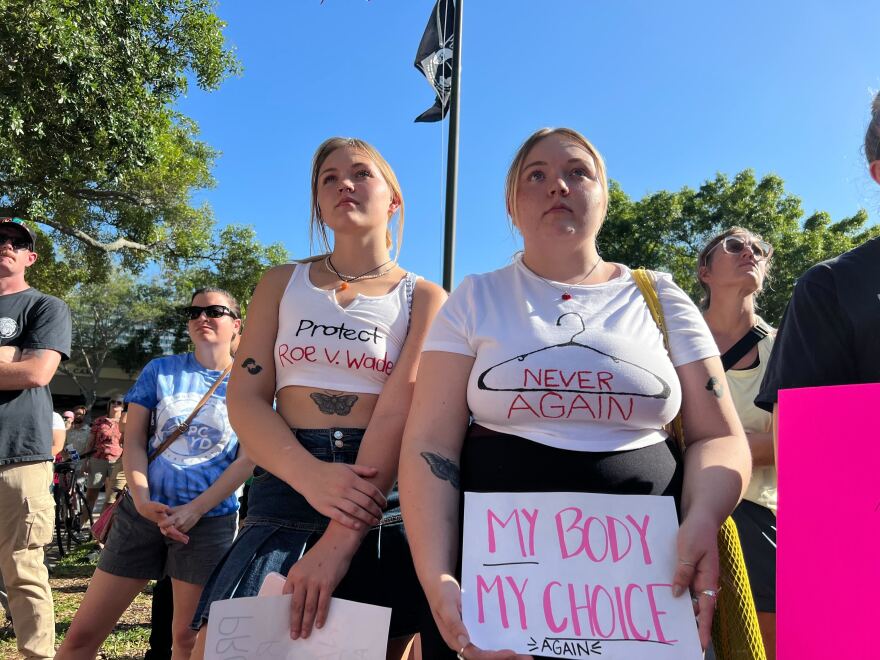 Women wearing abortion rights T-shirts and carrying posters stand at a rally in St. Petersburg. 